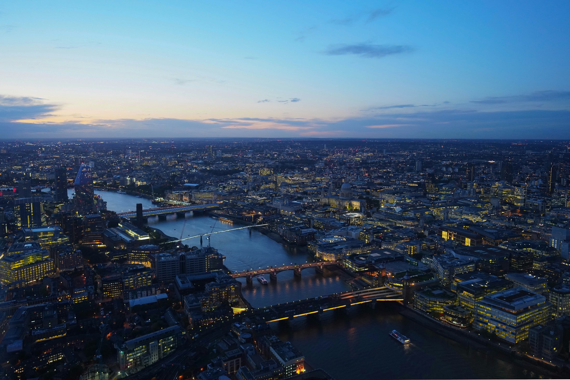 Aerial view of London and the Thames at nightfall